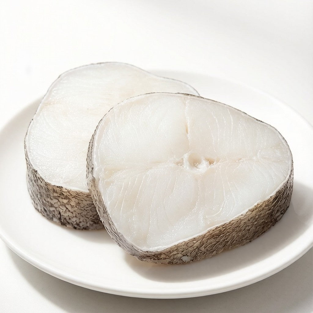 Thick cod loin steaks with white flaky flesh